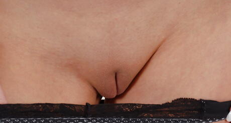 Stunning blond babe Gabriela unveils small tits and spreads her legs in bathroom