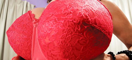 Hot oriental mature Minka in sexy underwear denudes big tits and spreads her legs 